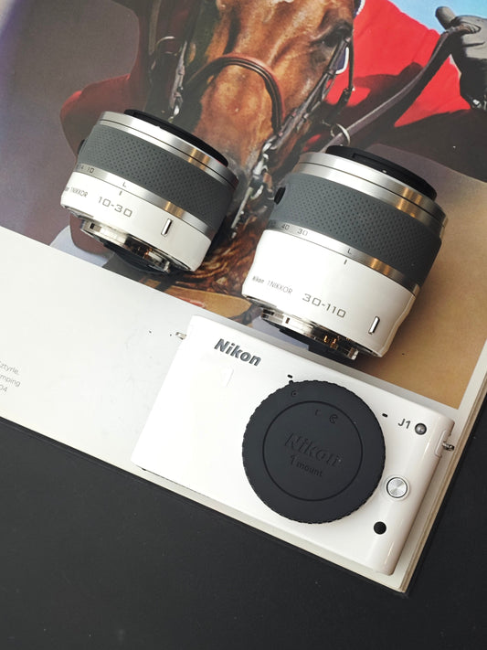 Used Nikon 1 J1 white with 10-30mm F3.5-5.6, 30-110mm F3.8-5.6
