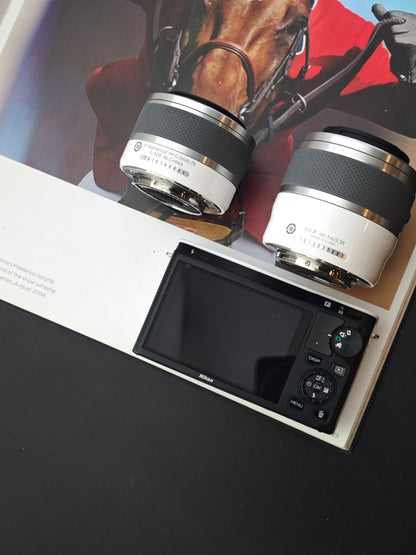 Used Nikon 1 J1 white with 10-30mm F3.5-5.6, 30-110mm F3.8-5.6