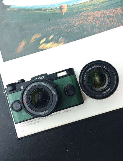 Used Pentax Q-S1 black&green with 02 Standard Zoom 5-15mm F2.8-4.5 and 06 Telephoto Zoom 15-45mm F2.8