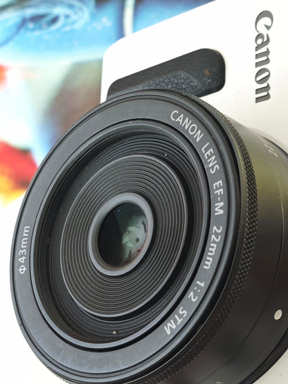 Used Canon EOS M white with EF-M 22mm F2 STM and EF-M 18-55mm F3.5-5.6 IS STM