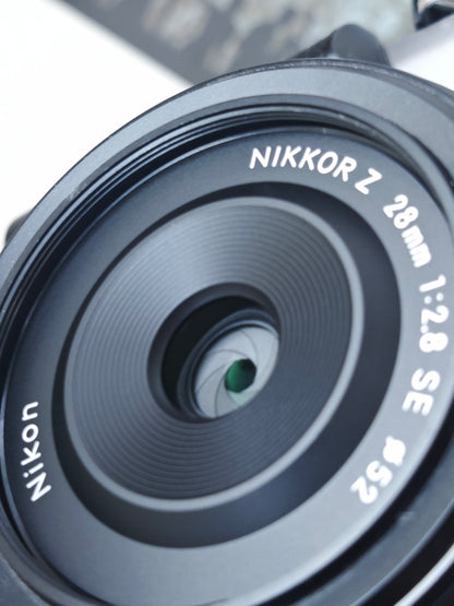 Used Nikon Zfc silver with 28mm F2.8 SE Digital Camera [No charger]