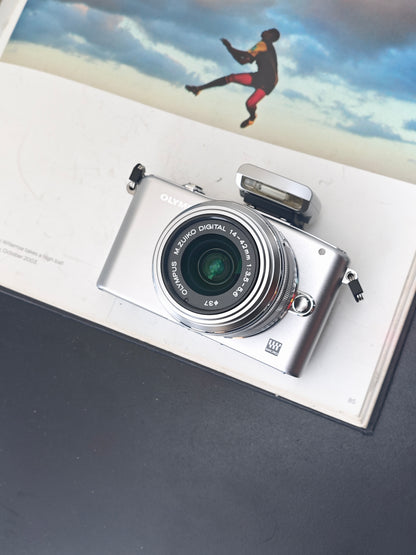 UsedOlympus PEN Mini E-PM1 with 14-42mm F3.5-5.6 II R MSC  [+4FS1, No charger]