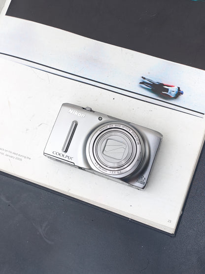 *READ* Used Nikon Coolpix S9500 silver Digital Camera [No charger]
