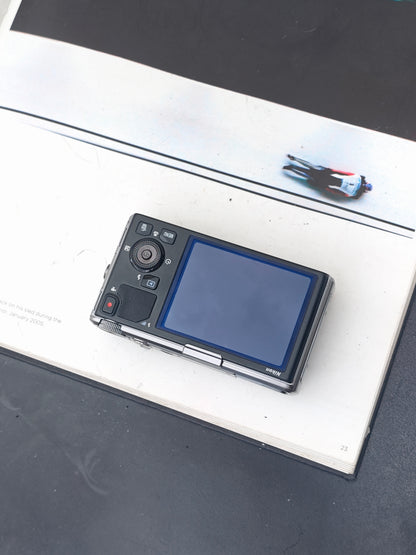 *READ* Used Nikon Coolpix S9500 silver Digital Camera [No charger]